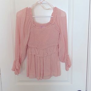 Ruffle detail half sleeve top. Peachy colored.
